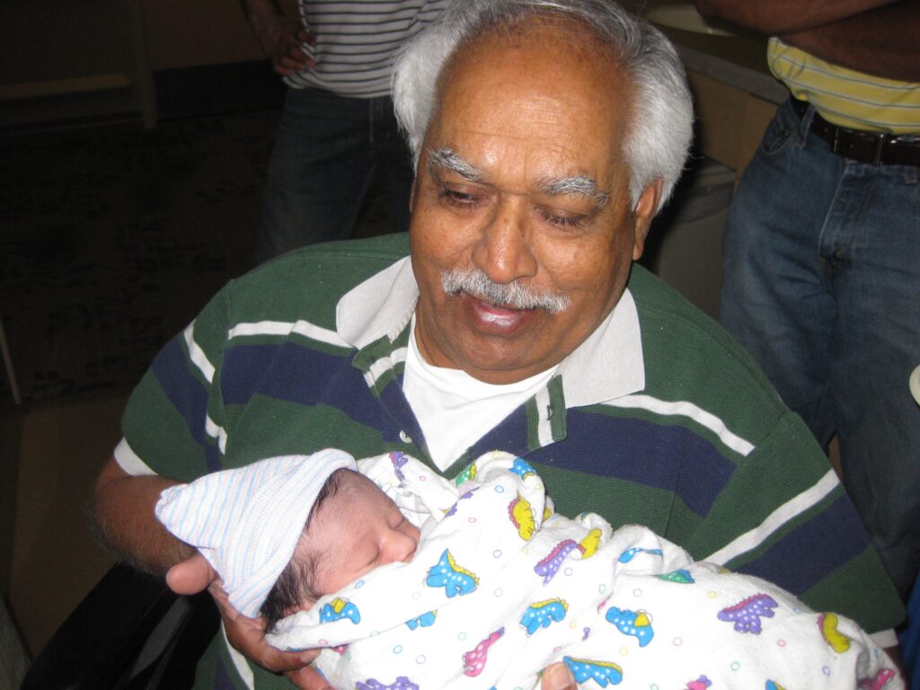 My father holding his granchild